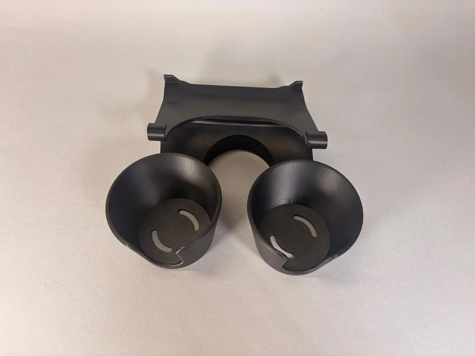 Underside view of the 1987–91 F-Series cup holder showing the mounting bracket